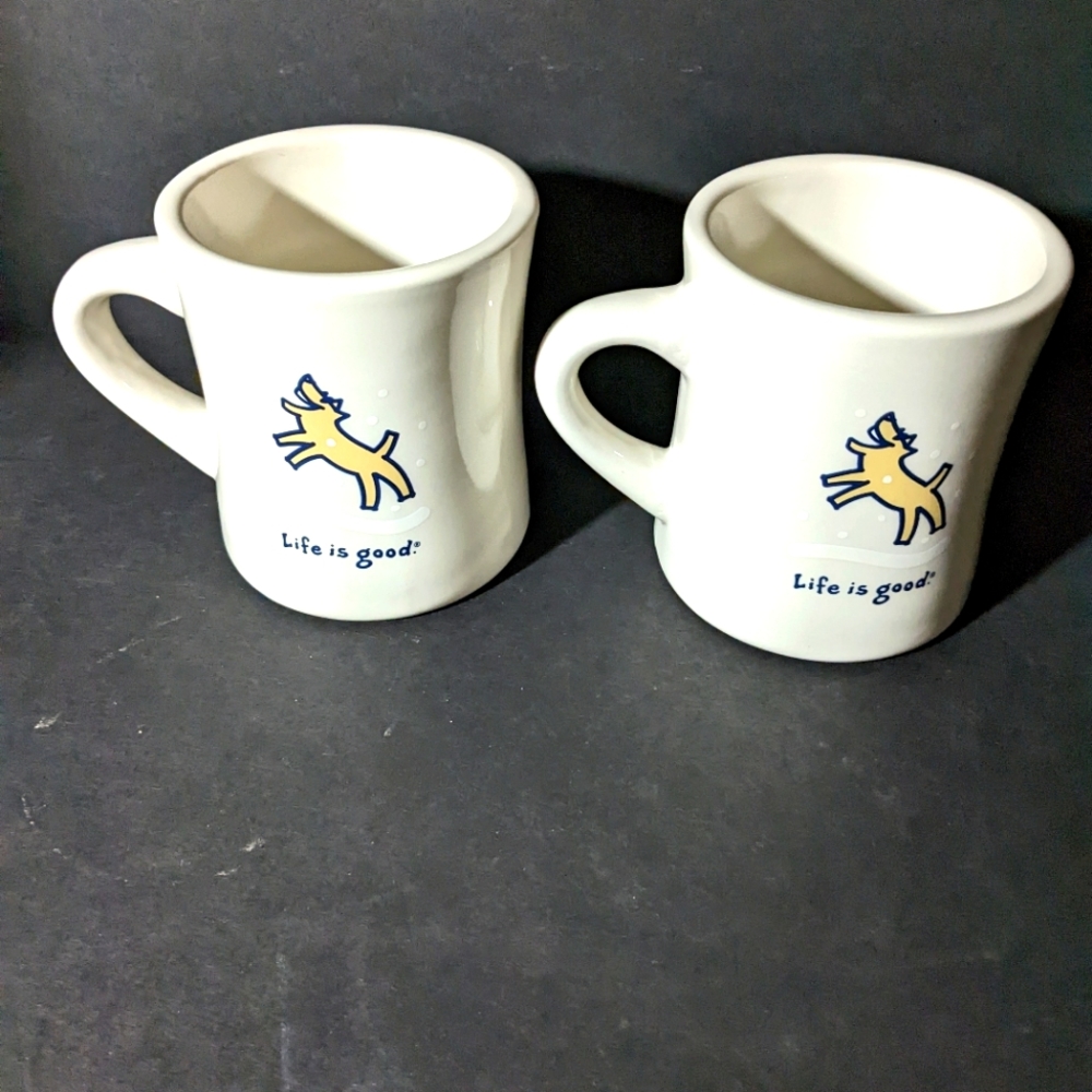 Set of two "Life is good" mugs.  Dog catching Snowflakes